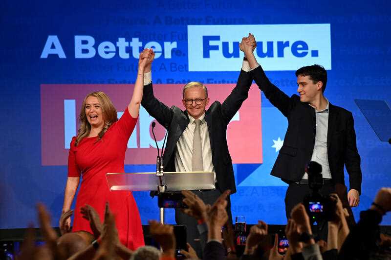 Anthony Albanese (centre) celebrates with his partner Jodie Haydon and son Nathan Albanese after after winning the 2022 Federal Election, at the Federal Labor Reception at Canterbury-Hurlstone Park RSL Club in Sydney