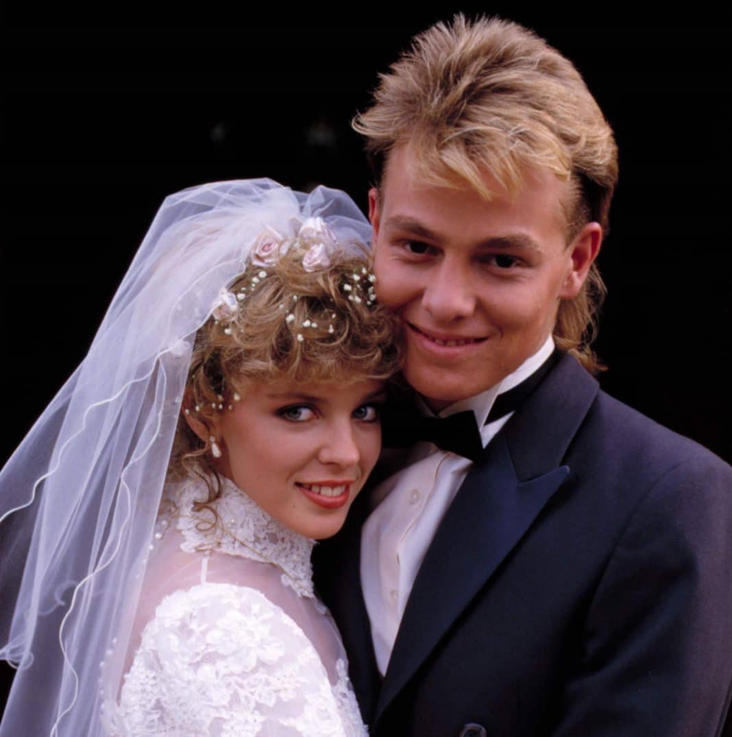 Supplied picture of Scott (right), played by Jason Donovan and Charlene, played by Kylie Minogue, tying the knot on Neighbours in the late 1980s.