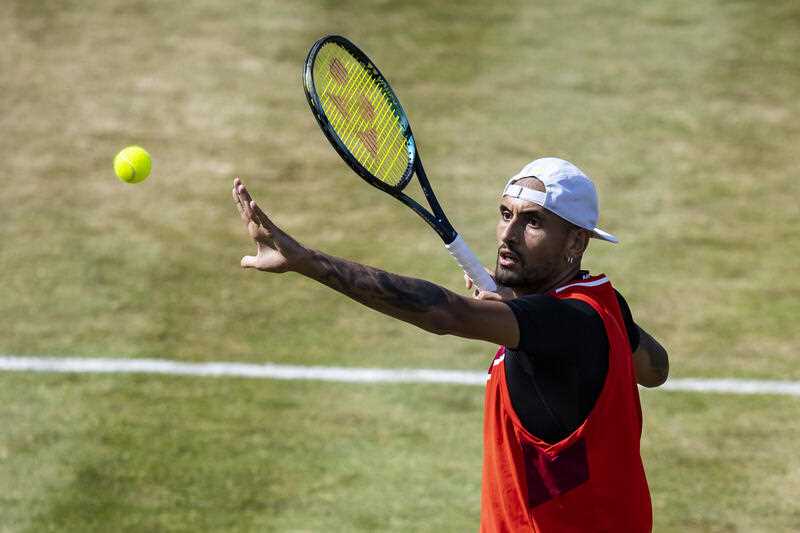 Australia's Nick Kyrgios serves to Britain's Andy Murray during their ATP tennis semifinals match in Stuttgart, Germany, Saturday, June 11, 2022.