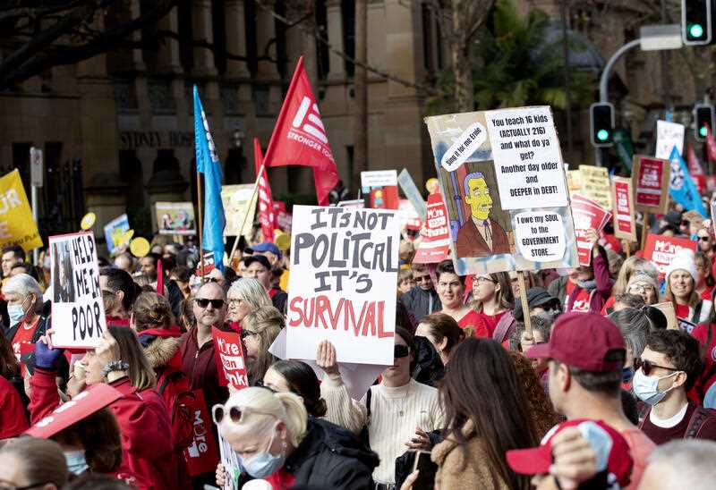 Teachers march to State Parliament during a strike by NSW public school and Catholic school teachers in Sydney, Thursday, June 30, 2022