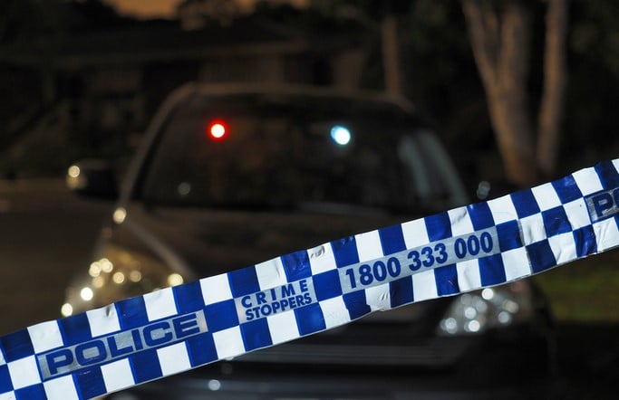 ACT police and crime stoppers tape at night