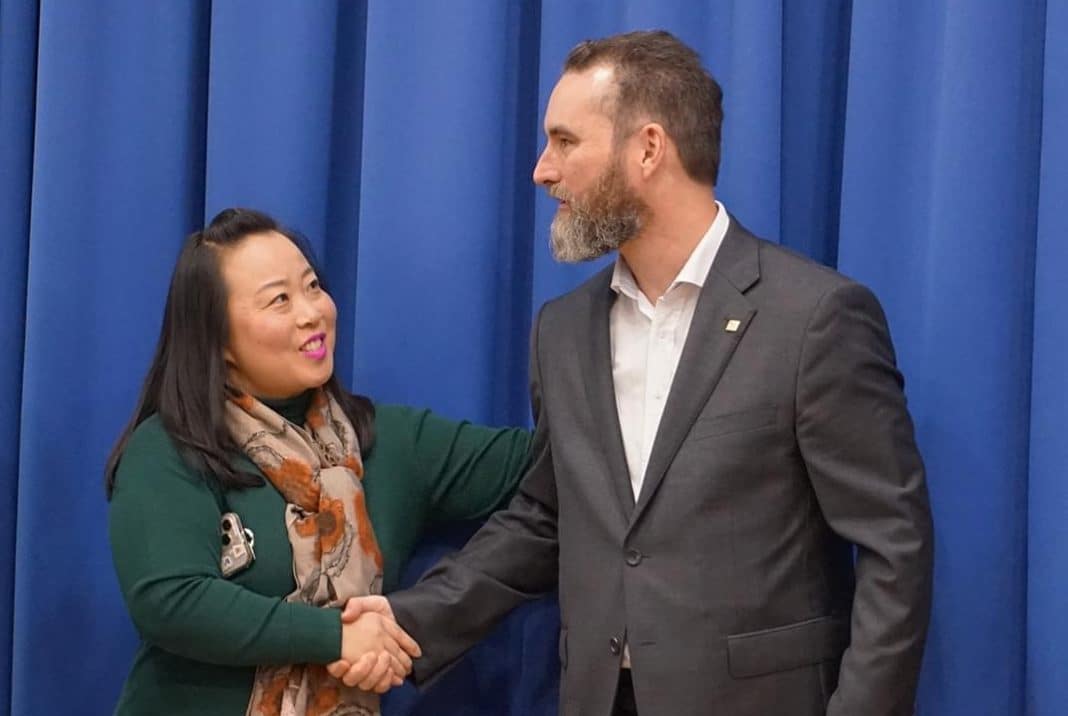 Elizabeth Lee shaking hands with new ACT MLA Ed Cocks