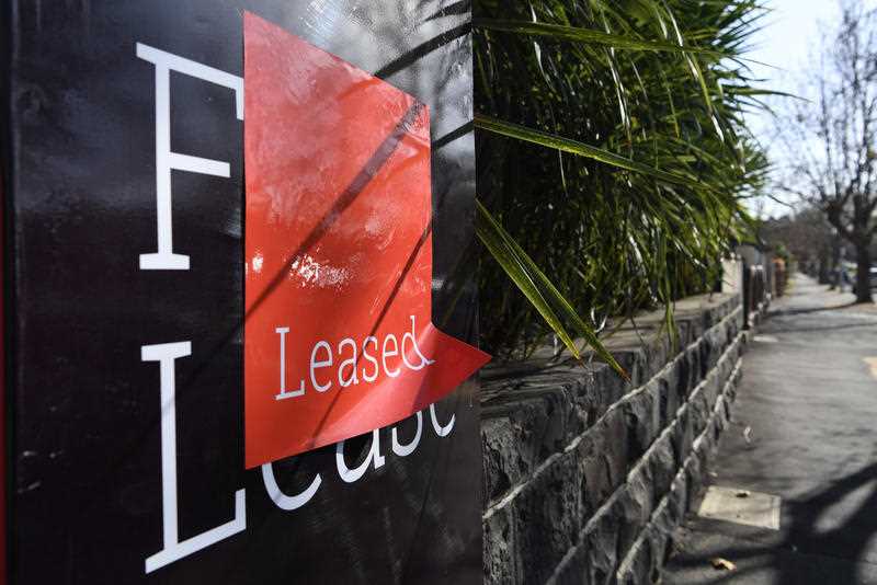 A Leased sign is seen outside a residential property