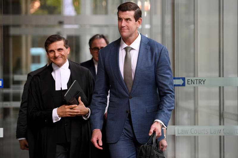 Ben Roberts-Smith along with barrister Arthur Moses (left) leaves the Federal Court of Australia in Sydney, Wednesday, March 16, 2022