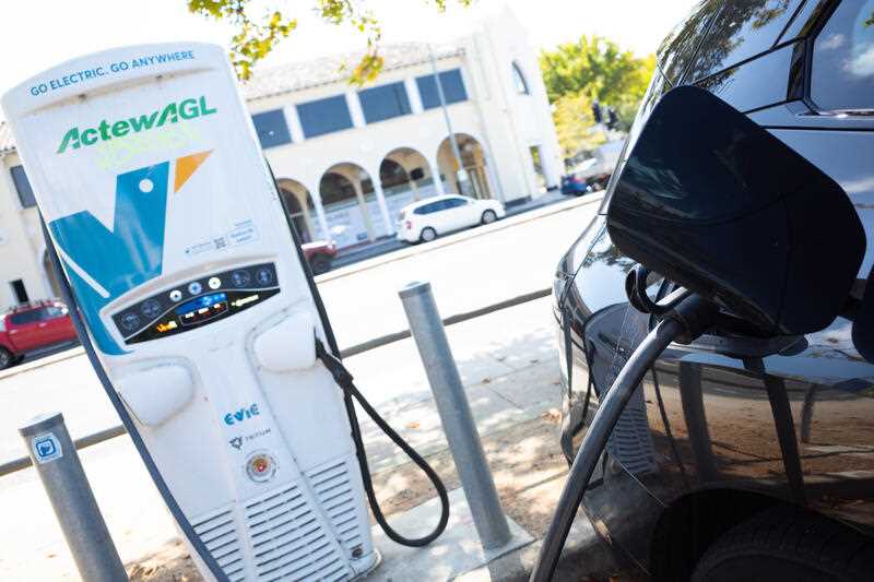 An electric car is seen recharging at an ActewAGL charging station in Canberra