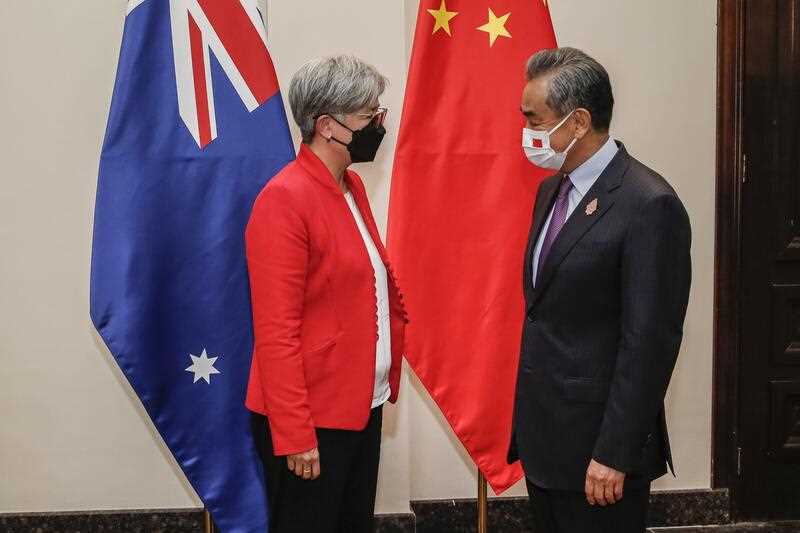 Australian Foreign Minister Penny Wong speaks with Chinese Foreign Minister Wang Yi at a bilateral meeting during the the G20 Foreign Ministers' Meeting at Nusa Dua in South Kuta, Bali, Indonesia, Friday, July 8, 2022