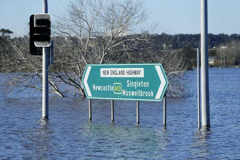 The New England Highway is still blocked by floodwaters in Maitland, Saturday, July 9, 2022.
