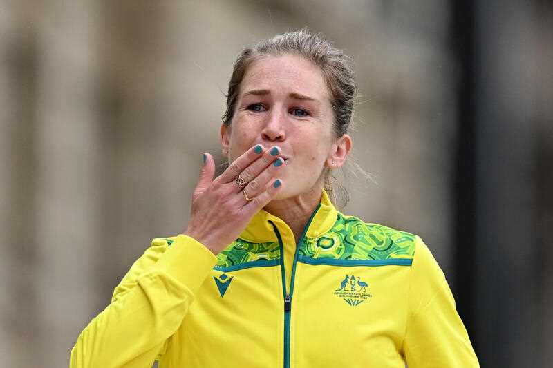 Jessica Stenson of Australia gestures after being presented the gold medal in the medal Ceremony for the Women’s Marathon Final on Day 2 of the XXII Commonwealth Games at Victoria Square in Birmingham, England, Saturday, July 30, 2022