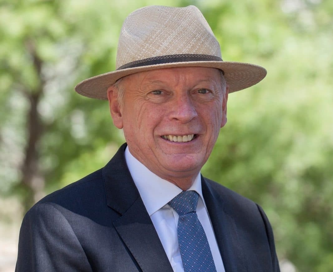 Canberra Liberals MLA Peter Cain wearing a straw hat and suit