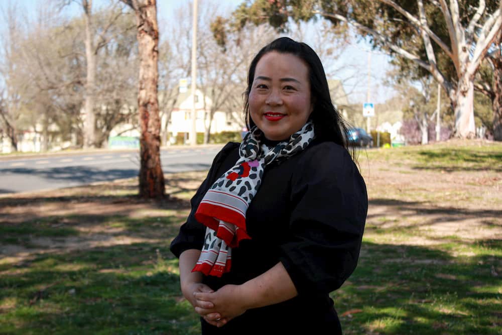Canberra Liberals leader Elizabeth Lee is seen smiling at the camera in the outdoors