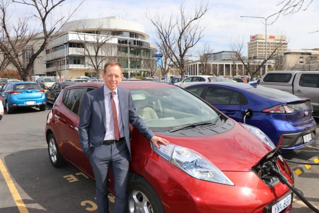 Shane Rattenbury, ACT Minister for Water, Energy and Emissions, with an electric vehicle. File photo.