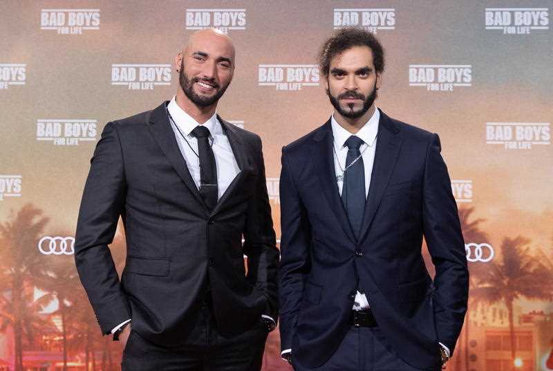 Belgian directors Adil El Arbi (L) and Bilall Fallah pose on the red carpet at a film premiere in Berlin in 2020