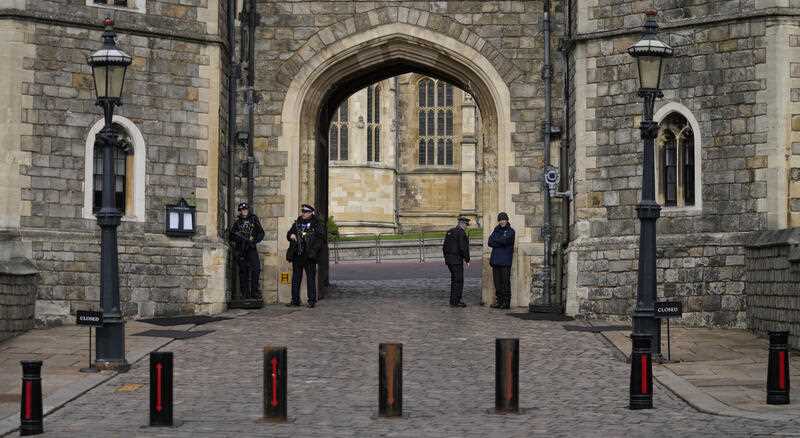 Police guard the Henry VIII gate to Windsor Castle in Windsor, England