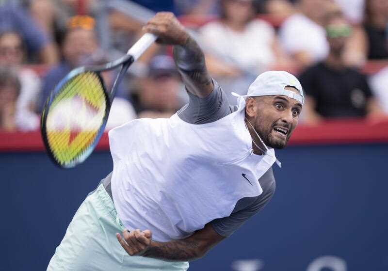 Nick Kyrgios of Australia serves to Daniil Medvedev during second round play at the National Bank Open tennis tournament Wednesday Aug. 10, 2022. in Montreal