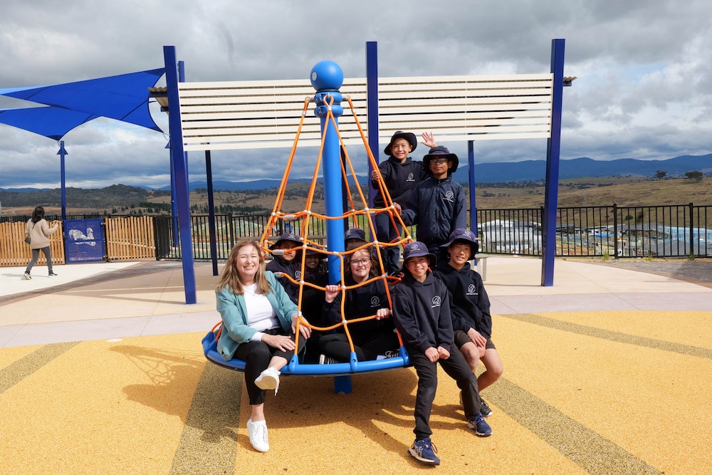 Yvette Berry, ACT Minister for Housing and Suburban Development, and Evelyn Scott School students at Blue Poles Park. Photo: ACT Government
