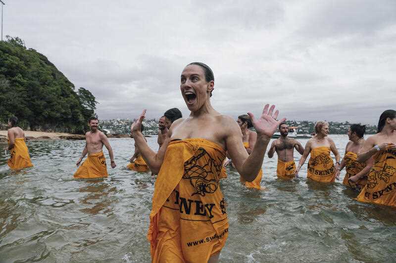 Nude swimmers participate in the Sydney Skinny ocean swim at Cobbler’s Beach in Sydney, Sunday, March 12, 2023