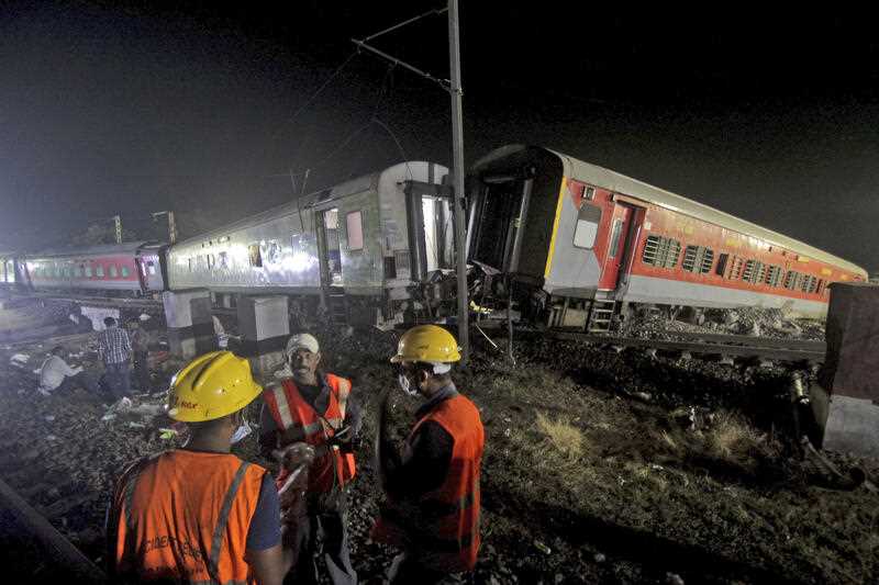 Rescuers work at the site of passenger trains accident, in Balasore district, in the eastern Indian state of Orissa