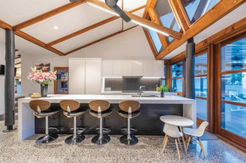 kitchen with stools at island
